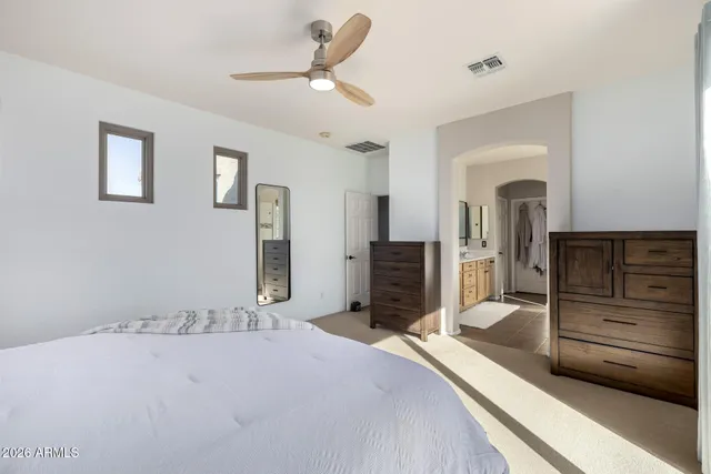 a view of a patio with table and chairs and potted plants