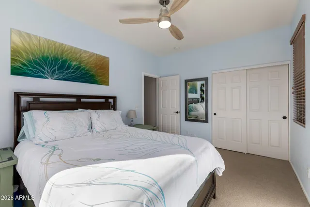 a swimming pool with outdoor seating and city view