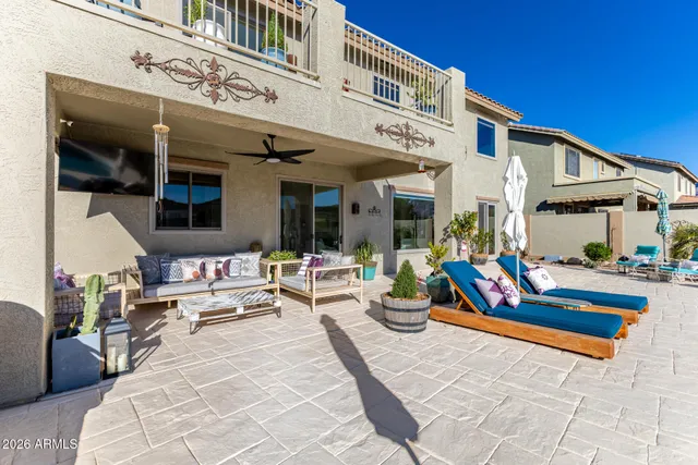 an aerial view of a houses with a swimming pool