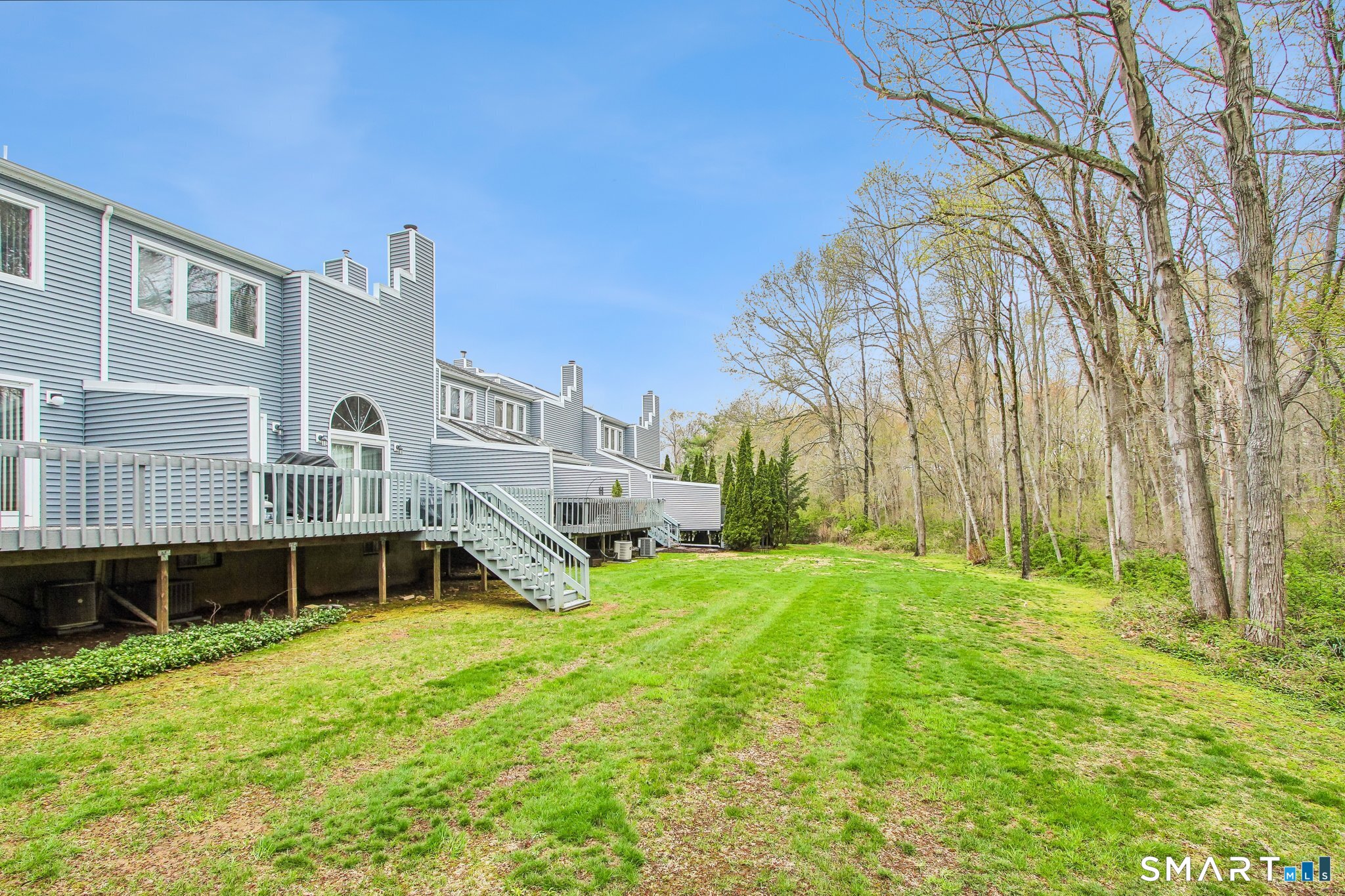 60 Clintonville Road, Unit 103 North Branford, CT 06472 - Photo 36 of 40 The complex offers a wonderful grassy area overlooking the woods.
