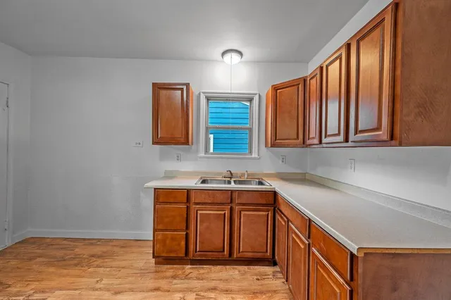 a kitchen with stainless steel appliances granite countertop a sink and a cabinets