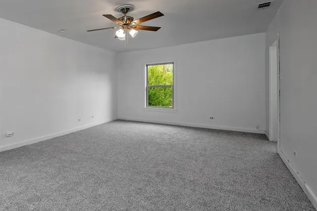 a view of a big room with carpet
