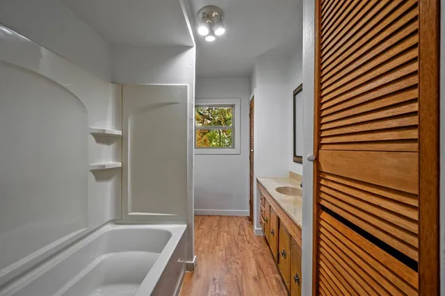 a bathroom with a bathtub and a shower