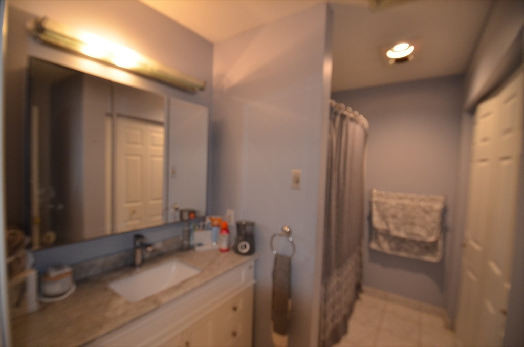 2 Rocky Nook, Unit 2 Malden, MA 02148 - Photo 17 of 27 a bathroom with a sink and a mirror
