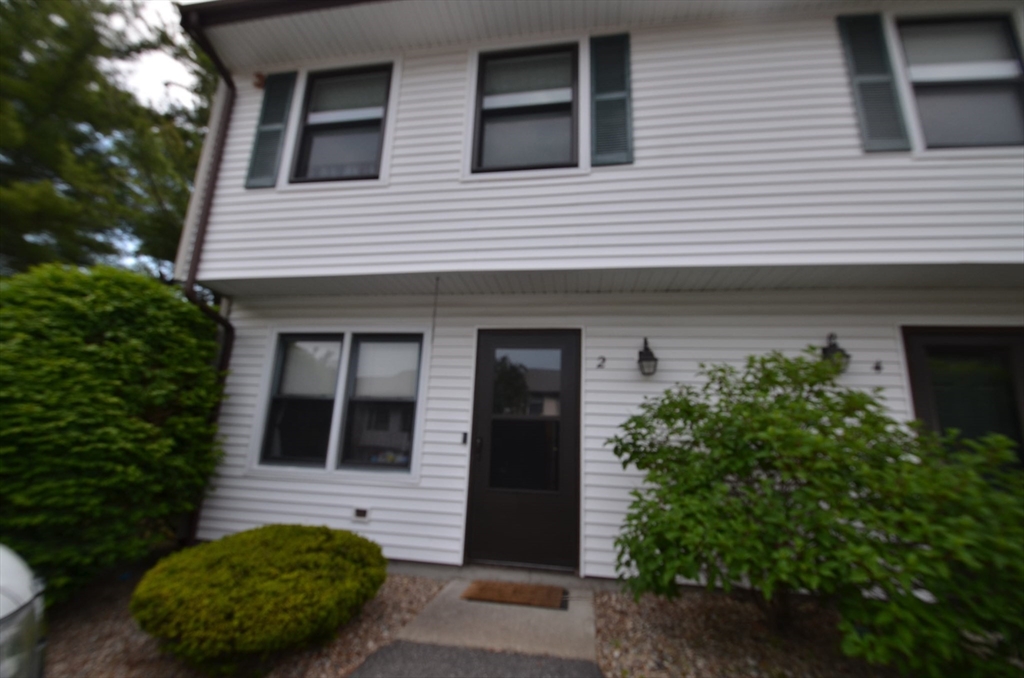 2 Rocky Nook, Unit 2 Malden, MA 02148 - Photo 2 of 27 a front view of a house with a garden