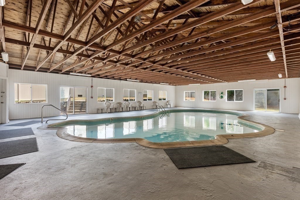 2 Rocky Nook, Unit 2 Malden, MA 02148 - Photo 24 of 27 a view of a swimming pool with outdoor seating