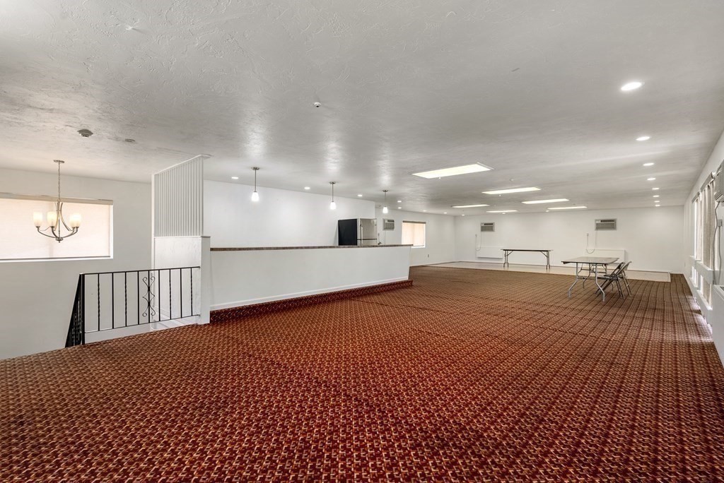 2 Rocky Nook, Unit 2 Malden, MA 02148 - Photo 26 of 27 a view of a living room a kitchen and a swimming pool