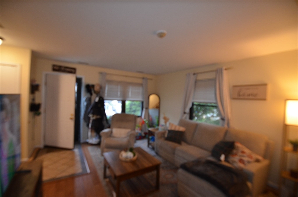 2 Rocky Nook, Unit 2 Malden, MA 02148 - Photo 5 of 27 a living room with furniture and a lamp