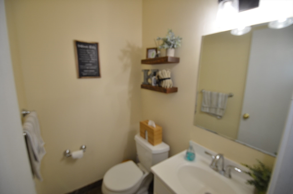 2 Rocky Nook, Unit 2 Malden, MA 02148 - Photo 6 of 27 a bathroom with a toilet sink and mirror