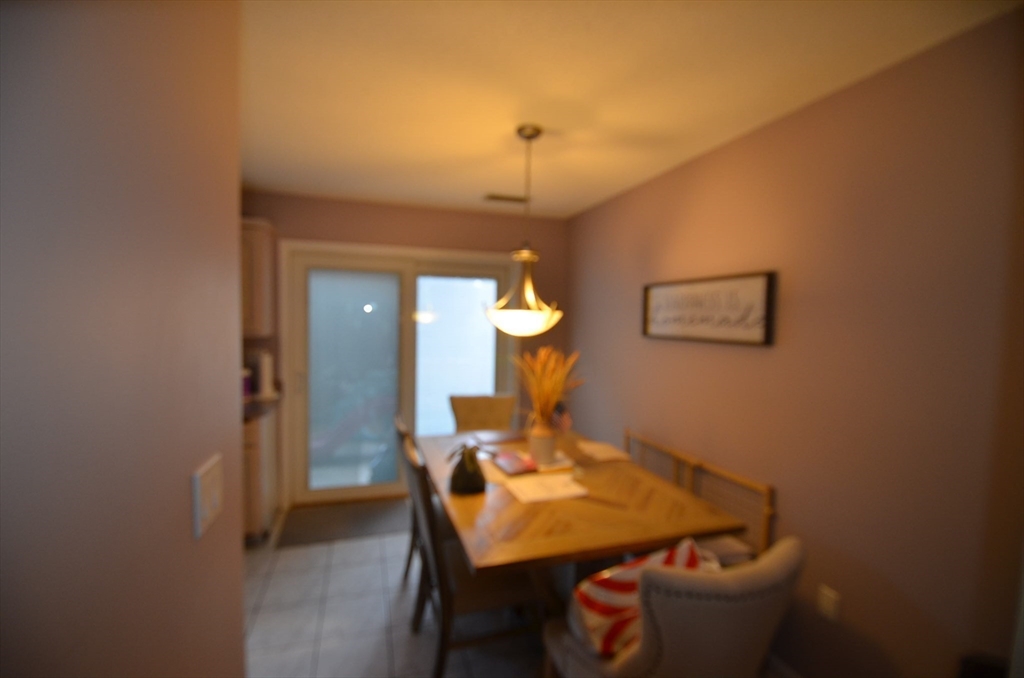 2 Rocky Nook, Unit 2 Malden, MA 02148 - Photo 7 of 27 a dining room with a table and chairs