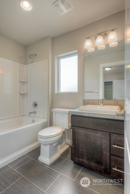 227 207th Street Southeast, Unit EH05 Bothell, WA 98012 - Photo 8 of 26 a bathroom with a sink a toilet and a bathtub
