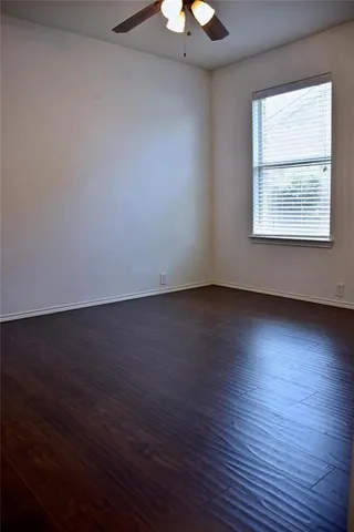 a bathroom with a granite countertop sink