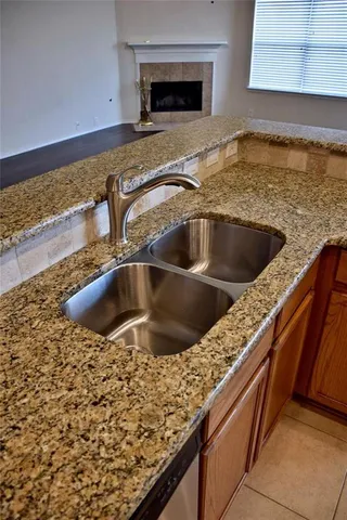 a view of a kitchen with a sink and microwave