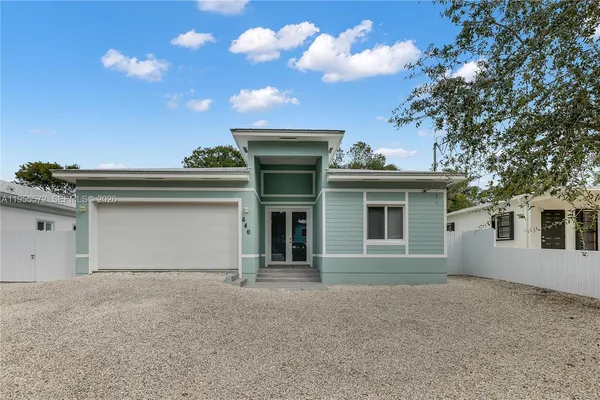 a front view of a house with a garage
