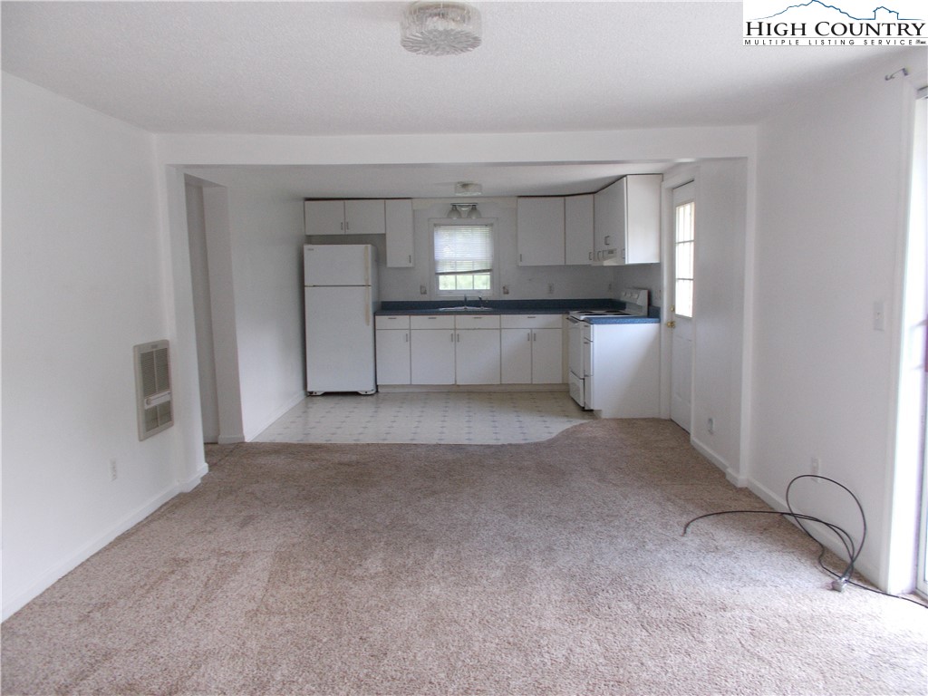 196 Boyden Road Banner Elk, NC 28604 - Photo 5 of 12 a view of empty room with kitchen