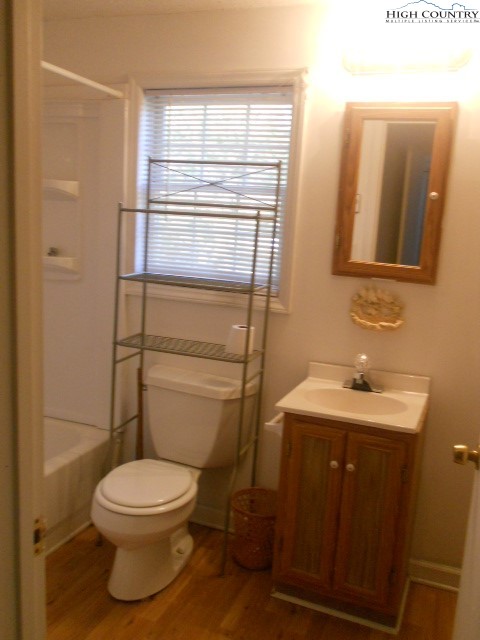 196 Boyden Road Banner Elk, NC 28604 - Photo 8 of 12 a bathroom with a toilet a sink and shower