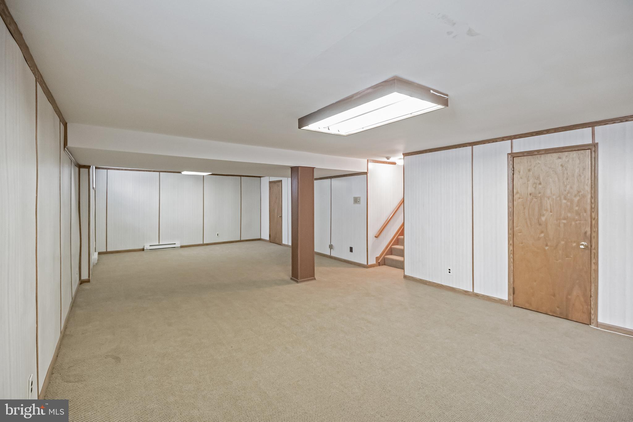 9659 Pine Road Philadelphia, PA 19115 - Photo 17 of 27 a view of an empty room with chandelier fan and closet area