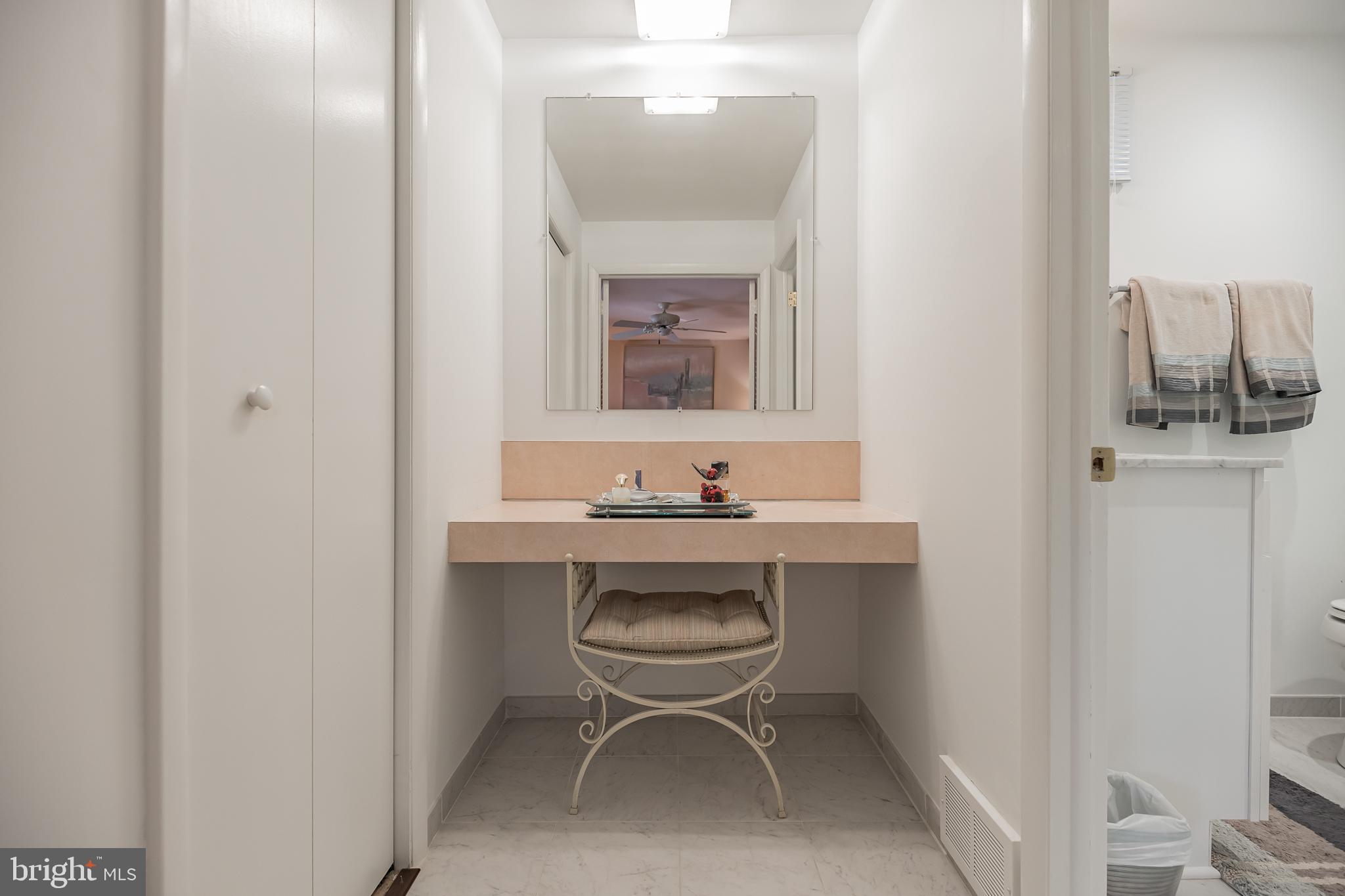 9659 Pine Road Philadelphia, PA 19115 - Photo 19 of 27 a bathroom with a toilet a sink and mirror