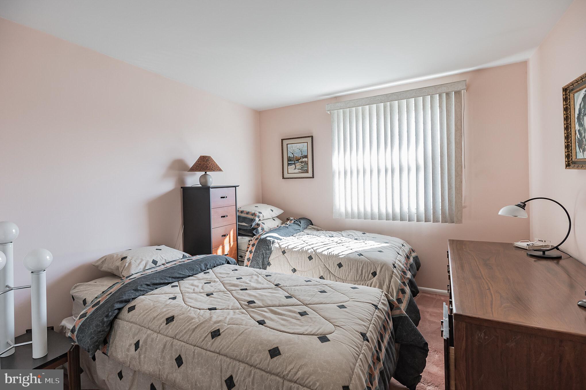 9659 Pine Road Philadelphia, PA 19115 - Photo 24 of 27 a bedroom with a bed and wooden floor