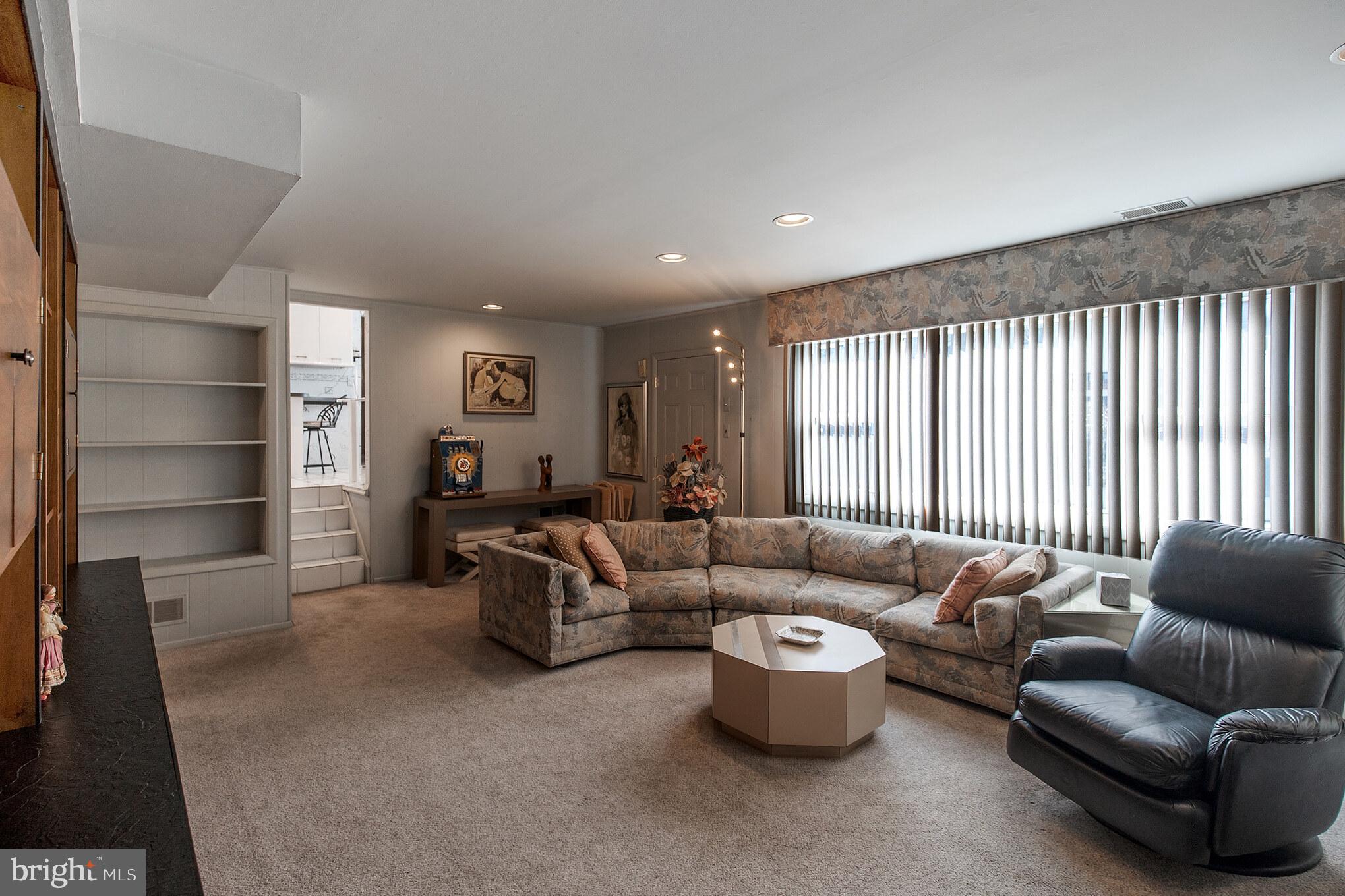 9659 Pine Road Philadelphia, PA 19115 - Photo 7 of 27 a living room with furniture and a large window