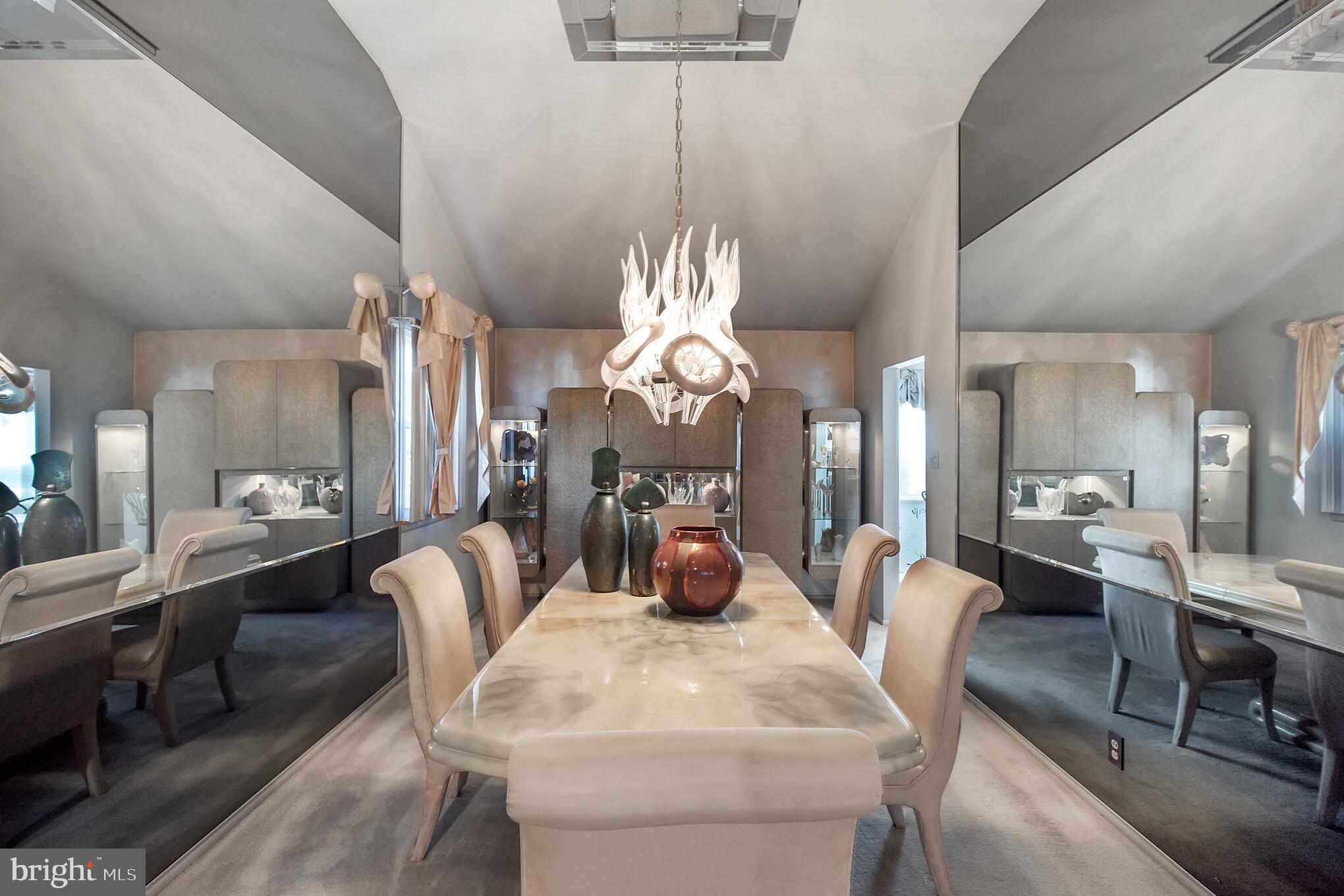 9659 Pine Road Philadelphia, PA 19115 - Photo 8 of 27 a view of a dining room with furniture a chandelier and wooden floor