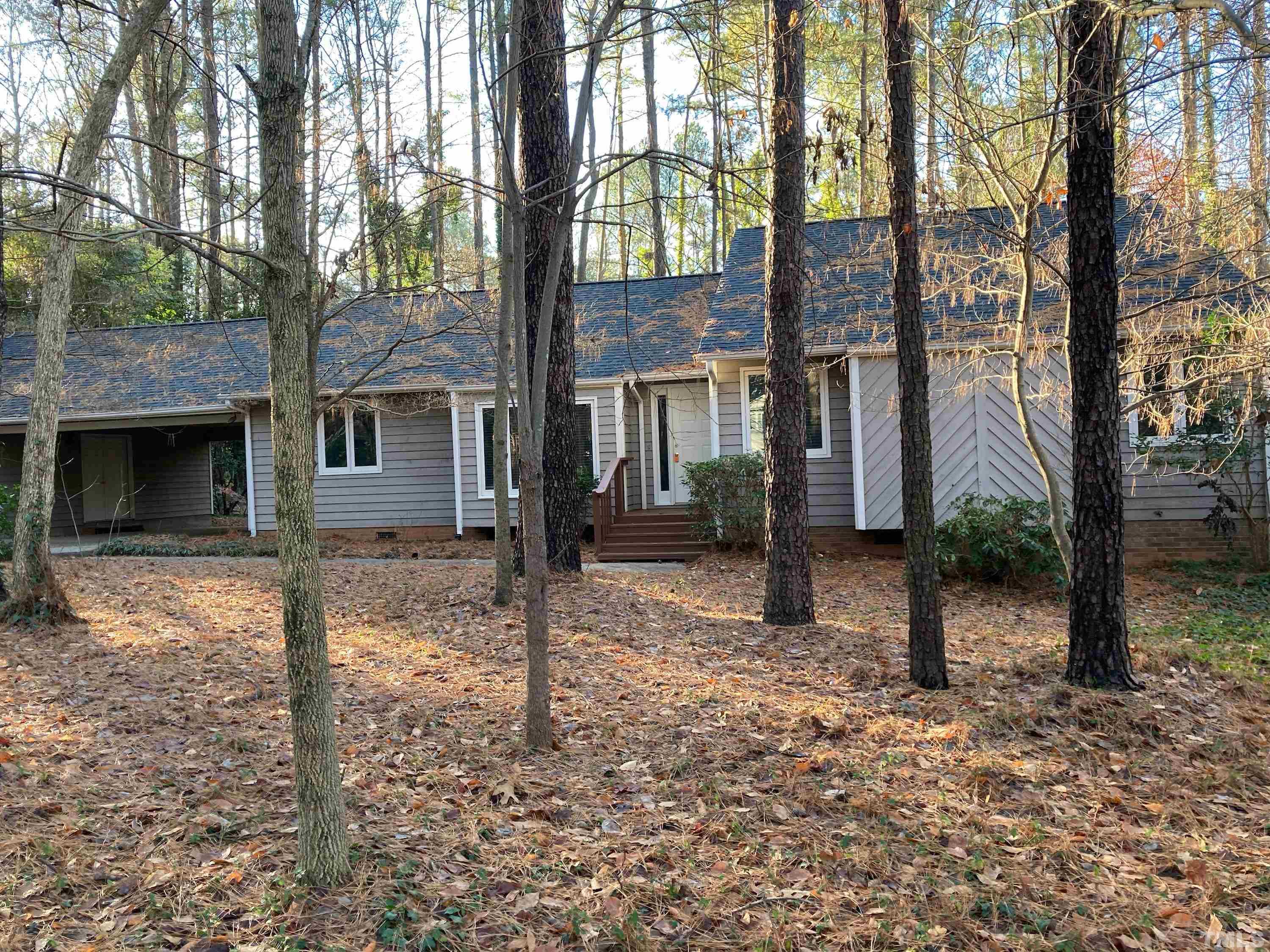 8708 Langtree Lane Raleigh, NC 27613 - Photo 2 of 21 a view of a house with a yard
