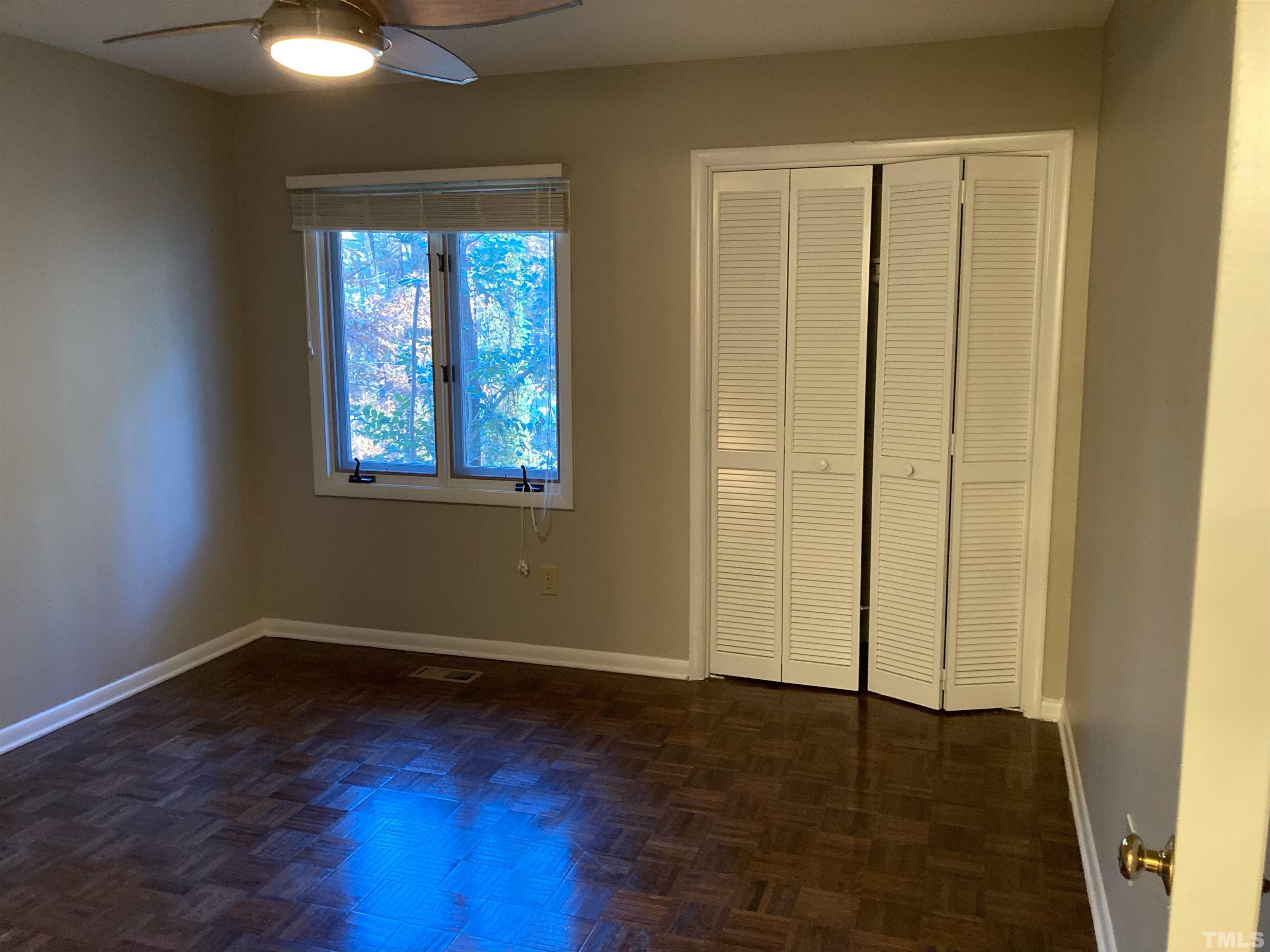 8708 Langtree Lane Raleigh, NC 27613 - Photo 14 of 21 an empty room with windows and closet