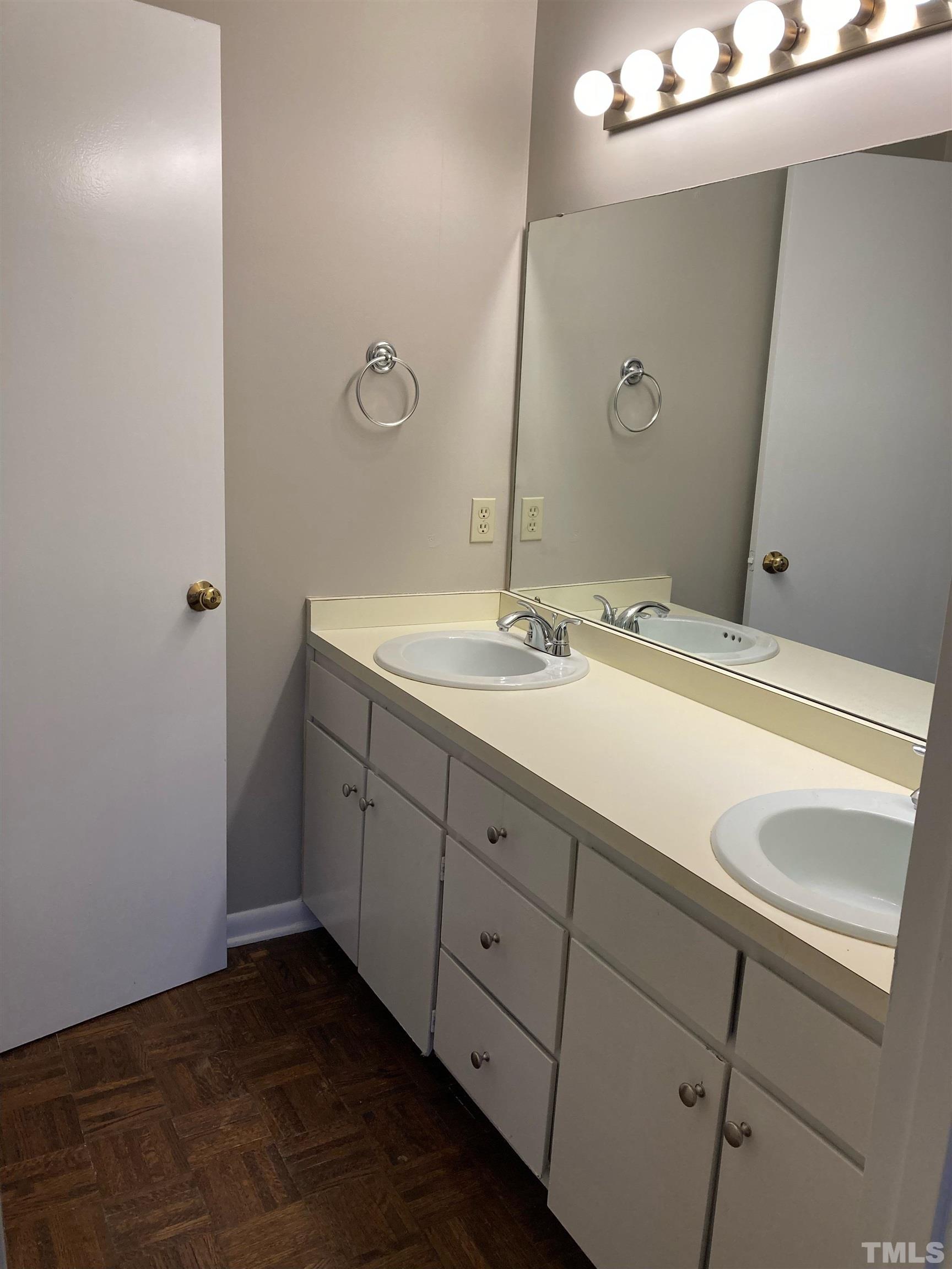 8708 Langtree Lane Raleigh, NC 27613 - Photo 15 of 21 a bathroom with a sink and a mirror