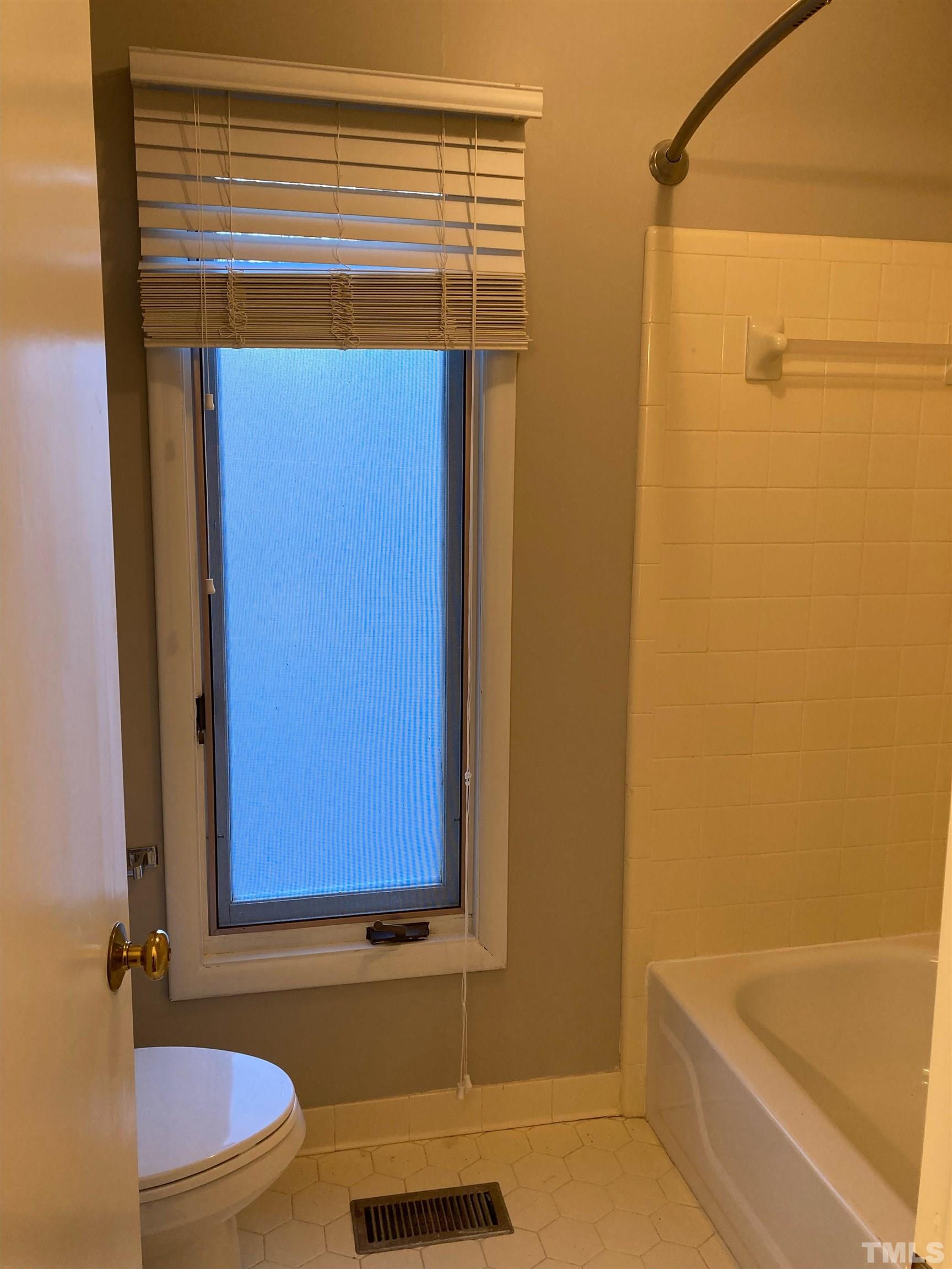 8708 Langtree Lane Raleigh, NC 27613 - Photo 16 of 21 a bathroom with a bathtub and shower