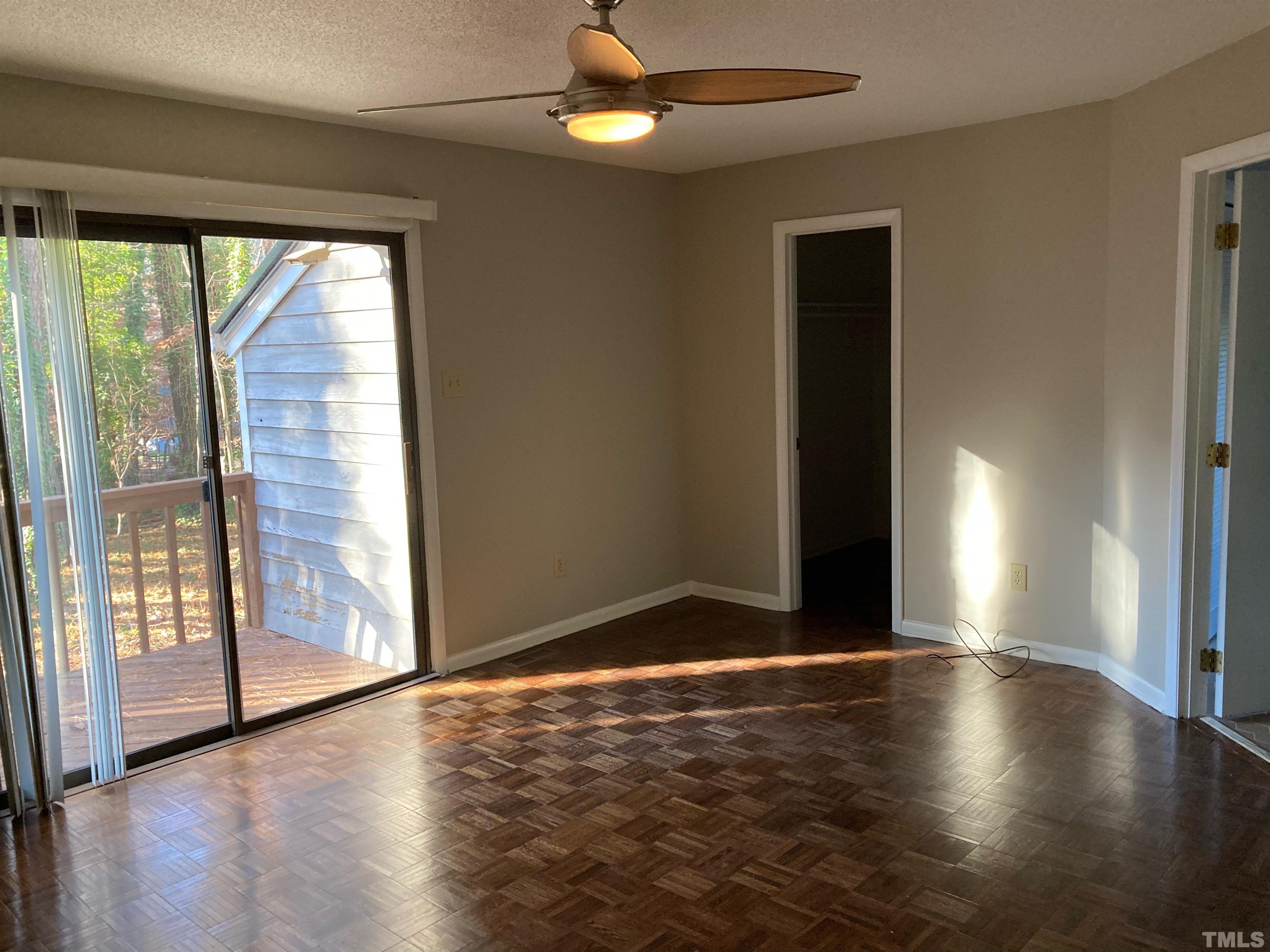 8708 Langtree Lane Raleigh, NC 27613 - Photo 17 of 21 an empty room with wooden floor and windows