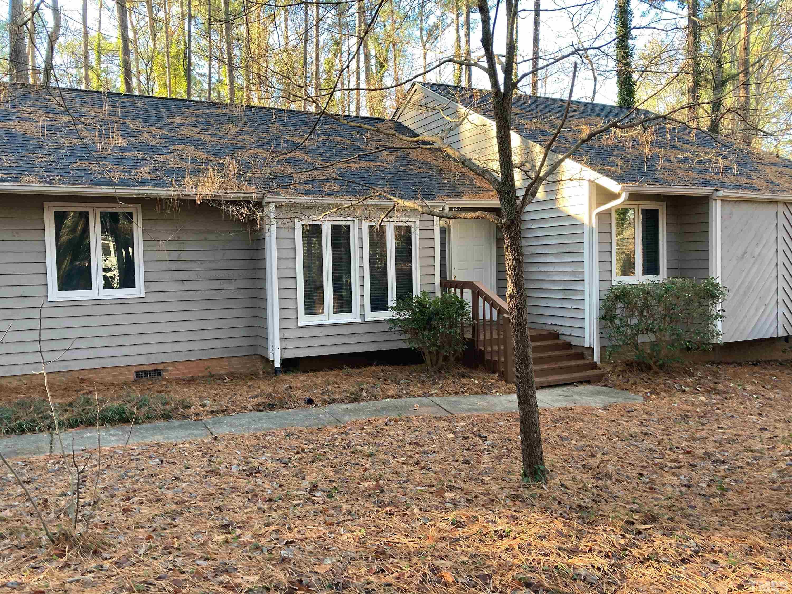 8708 Langtree Lane Raleigh, NC 27613 - Photo 3 of 21 a front view of a house with garden