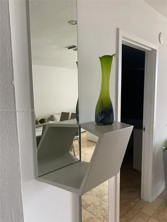 a bathroom with a sink and mirror