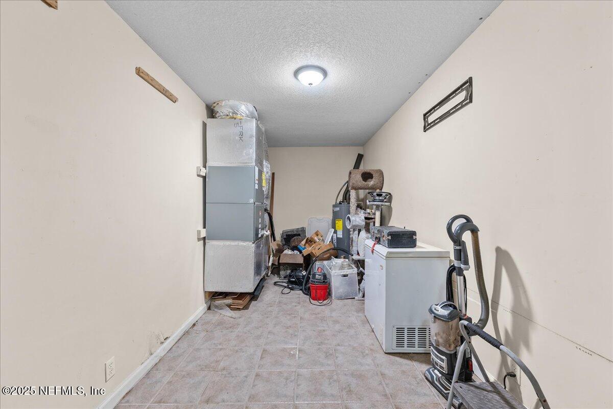 55056 Yellow Jacket Drive Callahan, FL 32011 - Photo 19 of 31 a view of a room with gym equipment