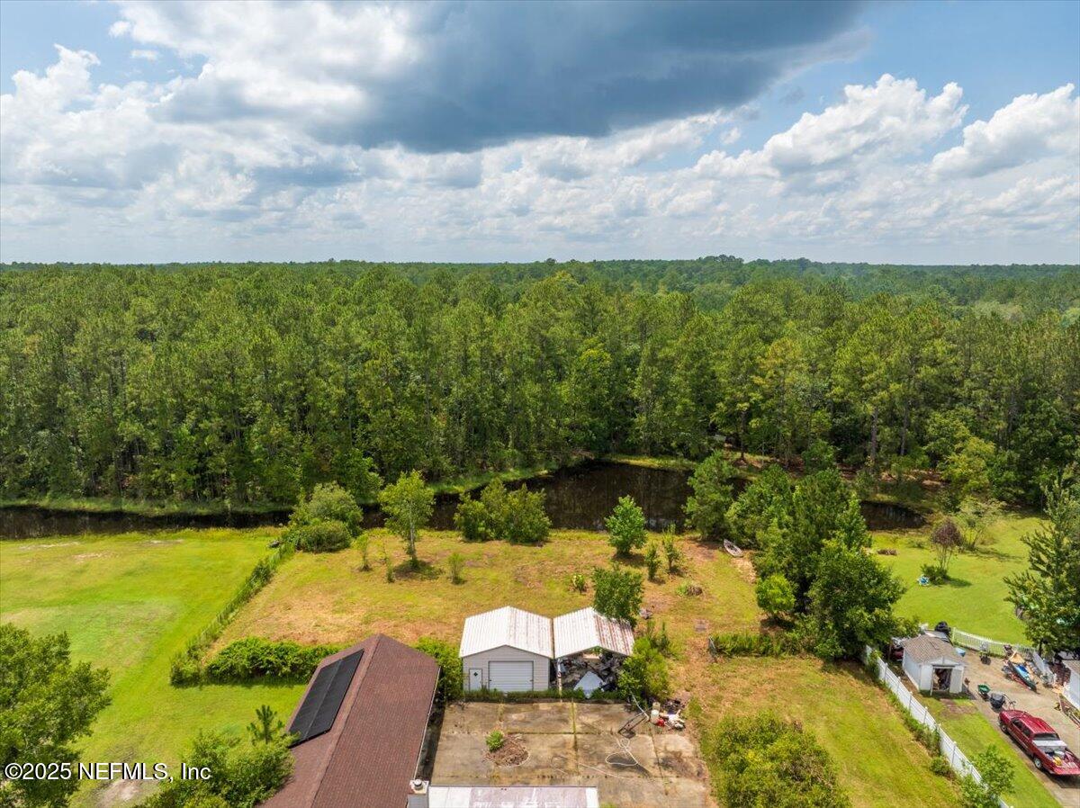 55056 Yellow Jacket Drive Callahan, FL 32011 - Photo 2 of 31 a view of a lake with houses in the back