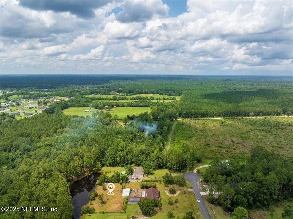 55056 Yellow Jacket Drive Callahan, FL 32011 - Photo 29 of 31 a view of a lake with a yard