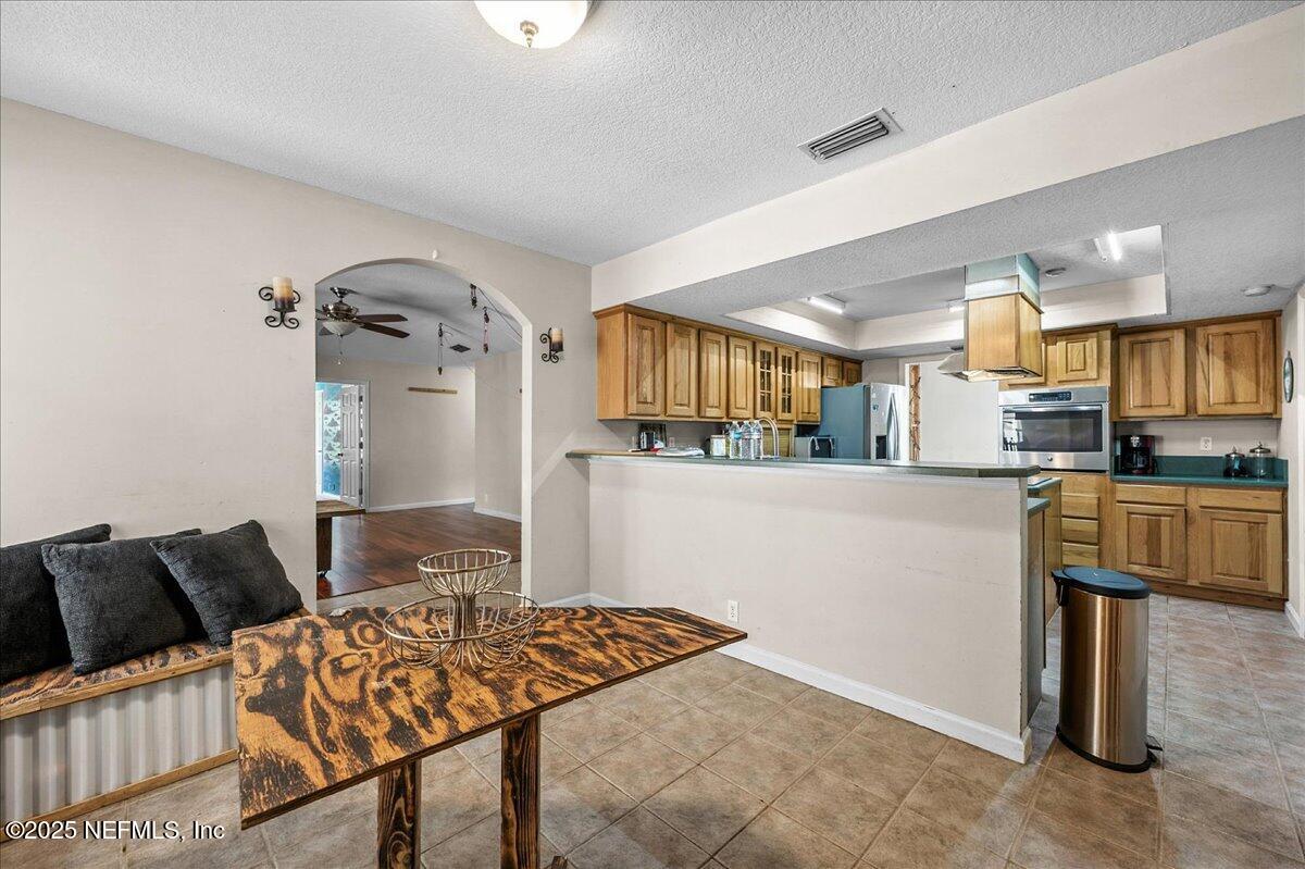 55056 Yellow Jacket Drive Callahan, FL 32011 - Photo 8 of 31 a living room with furniture and a wooden floor