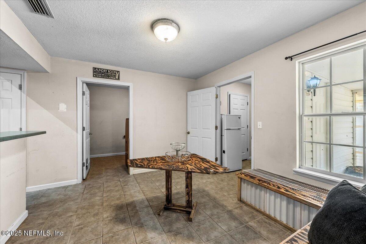 55056 Yellow Jacket Drive Callahan, FL 32011 - Photo 9 of 31 a living room with furniture and a window