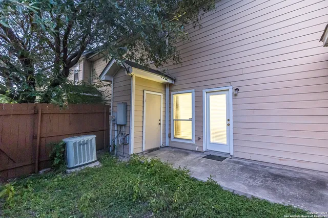 a house view with a backyard space
