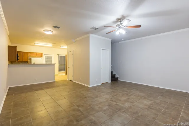 a view of a livingroom with kitchen and furniture