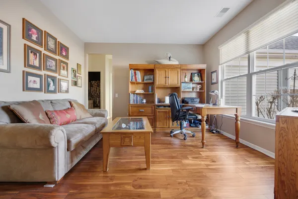 a living room with furniture and a large window