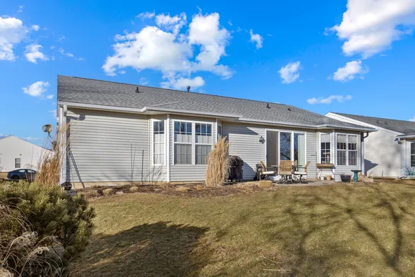 a front view of house with yard and seating space