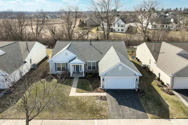 a view of house with a yard