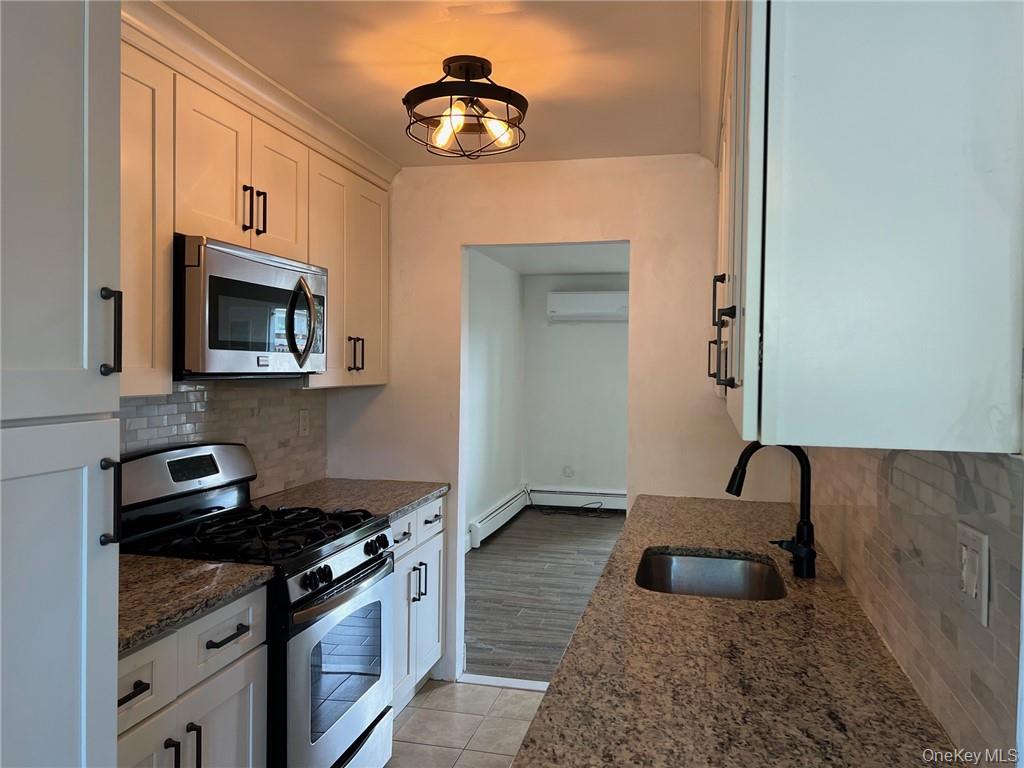 38 Hampton Court Middletown, NY 10941 - Photo 3 of 17 Kitchen with granite countertops, stainless steel appliances, sink, and white cabinets