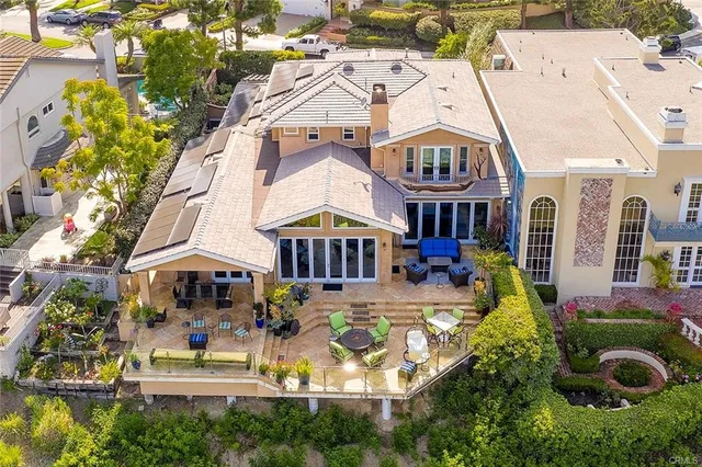 a bathroom with a granite countertop sink a toilet a mirror and shower