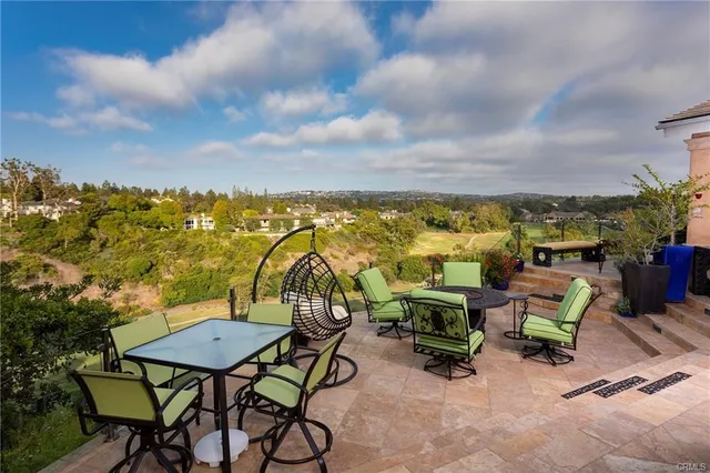 a living room with fireplace furniture and a flat screen tv