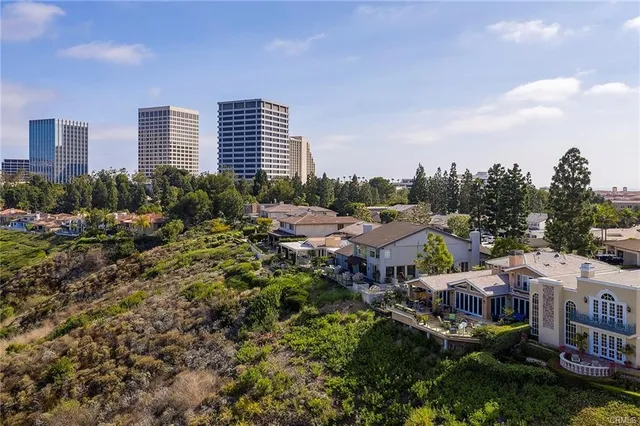 a bathroom with a granite countertop sink a mirror a bathtub and a shower