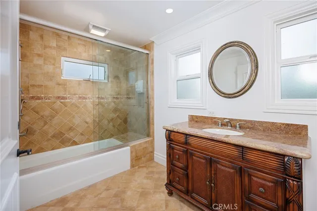 a kitchen with stainless steel appliances wooden floors and wooden cabinets