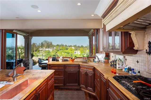 a view of a dining room with furniture wooden floor and chandelier