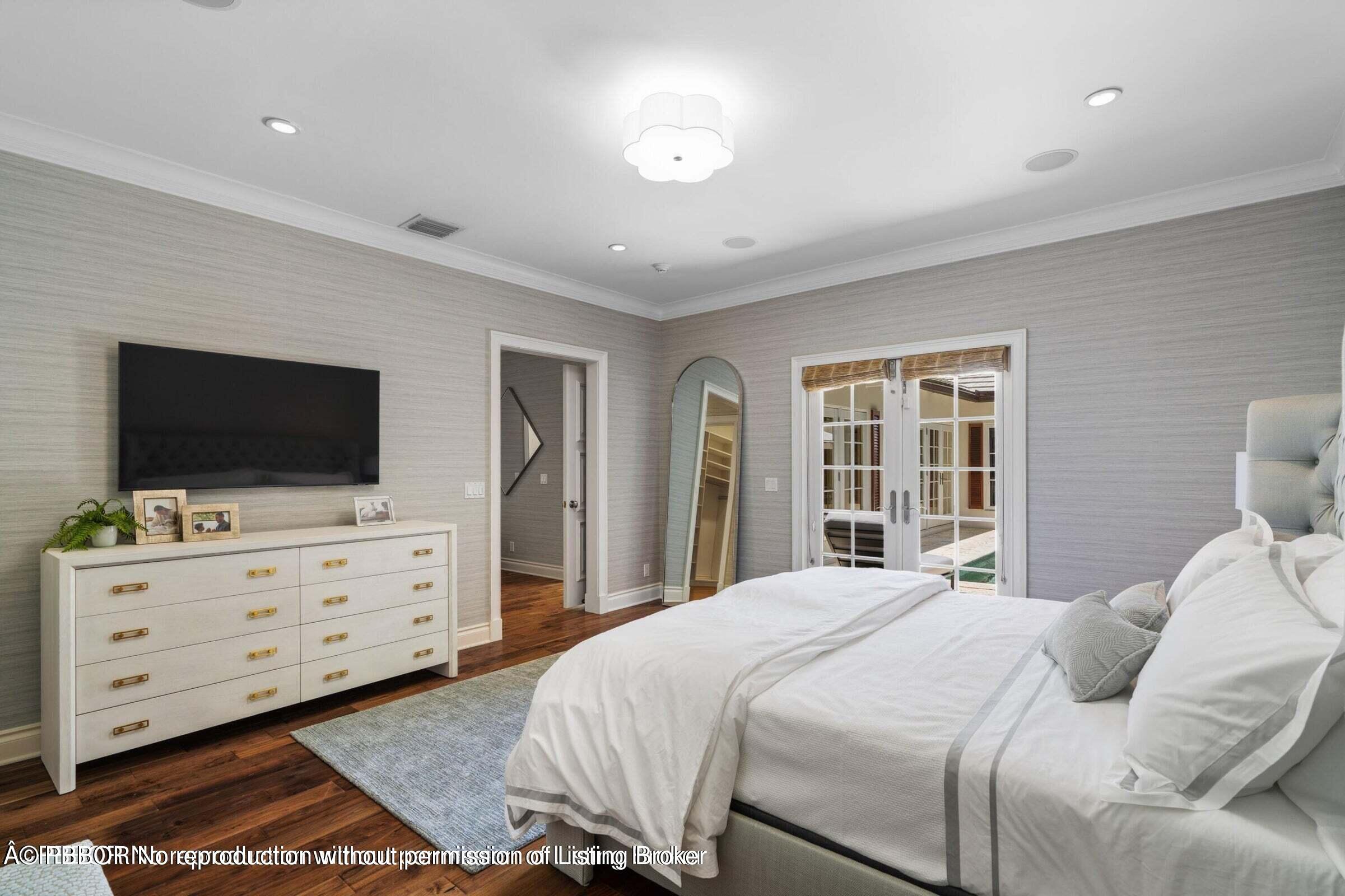 265 List Road Palm Beach, FL 33480 - Photo 11 of 21 a bedroom with a bed and wooden floor