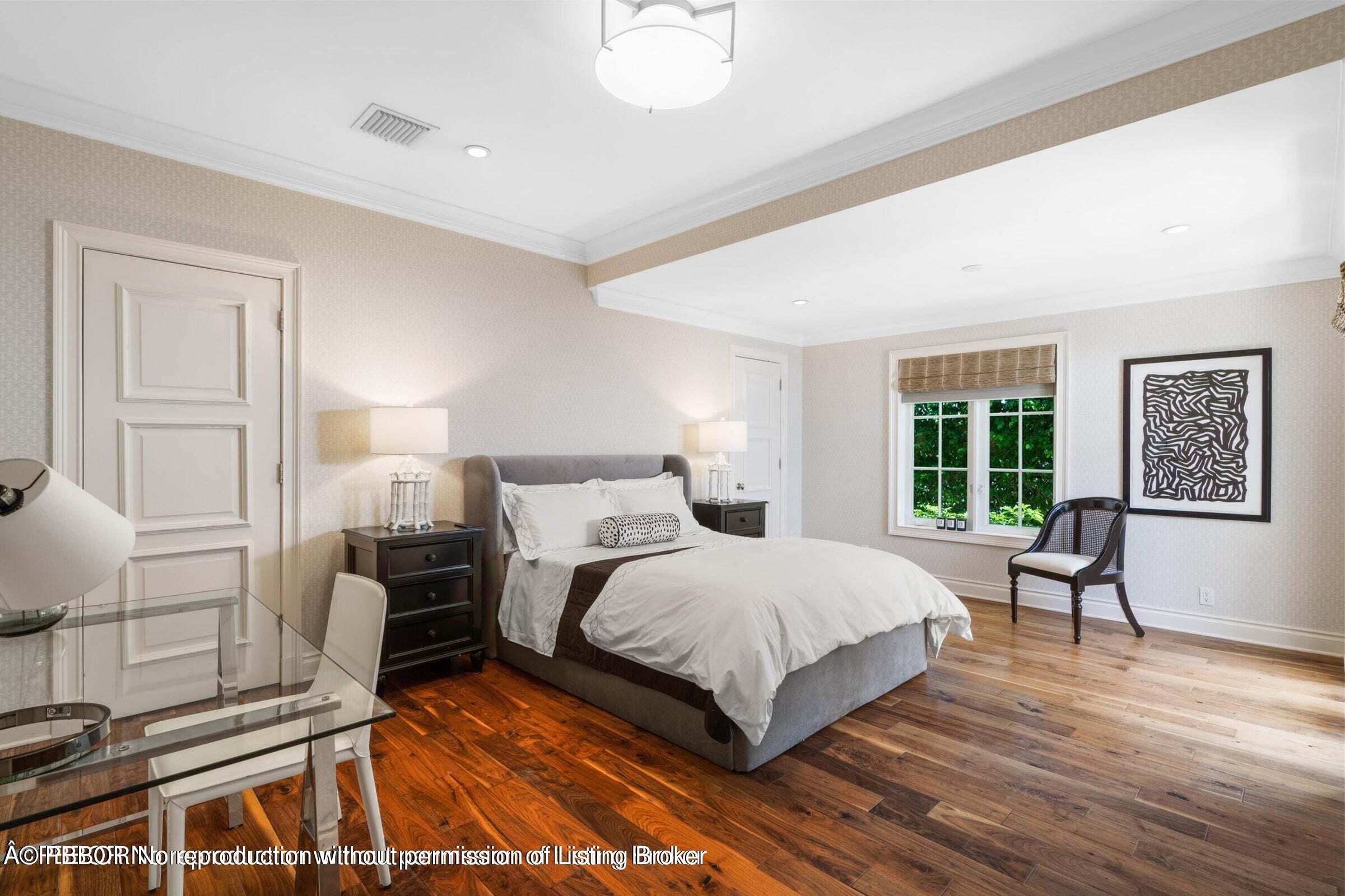 265 List Road Palm Beach, FL 33480 - Photo 13 of 21 a bedroom with a bed and wooden floor